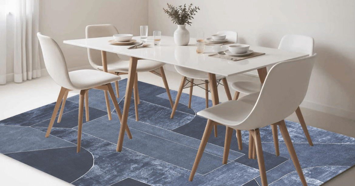 Blue handmade modern carpet placed under the dining table on white marble flooring