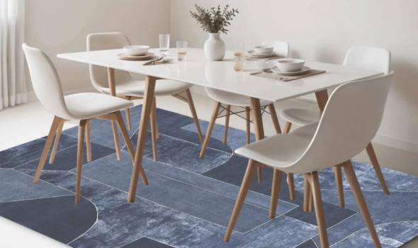 Blue handmade modern carpet placed under the dining table on white marble flooring